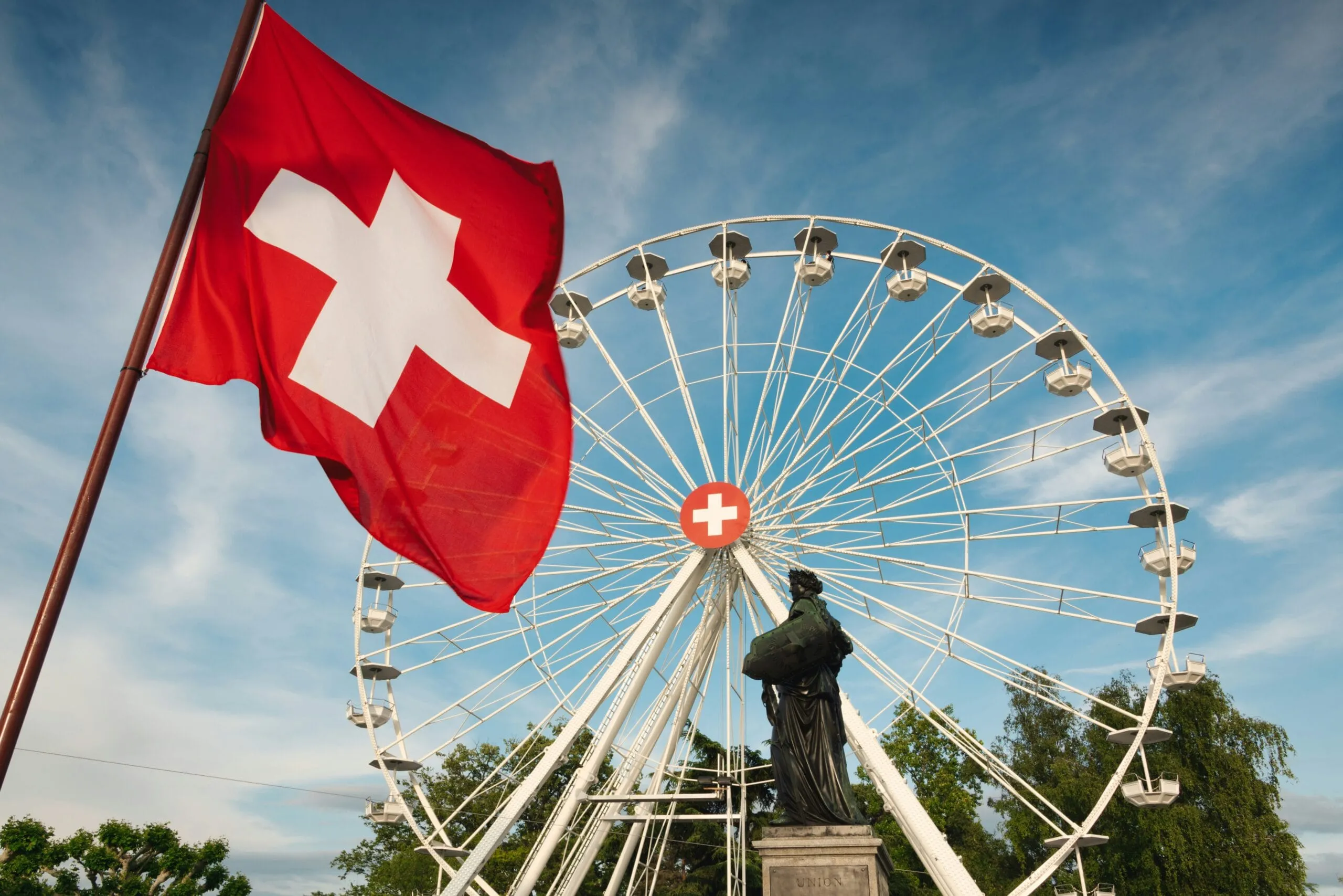 Swiss Flag in front of a ferris wheel