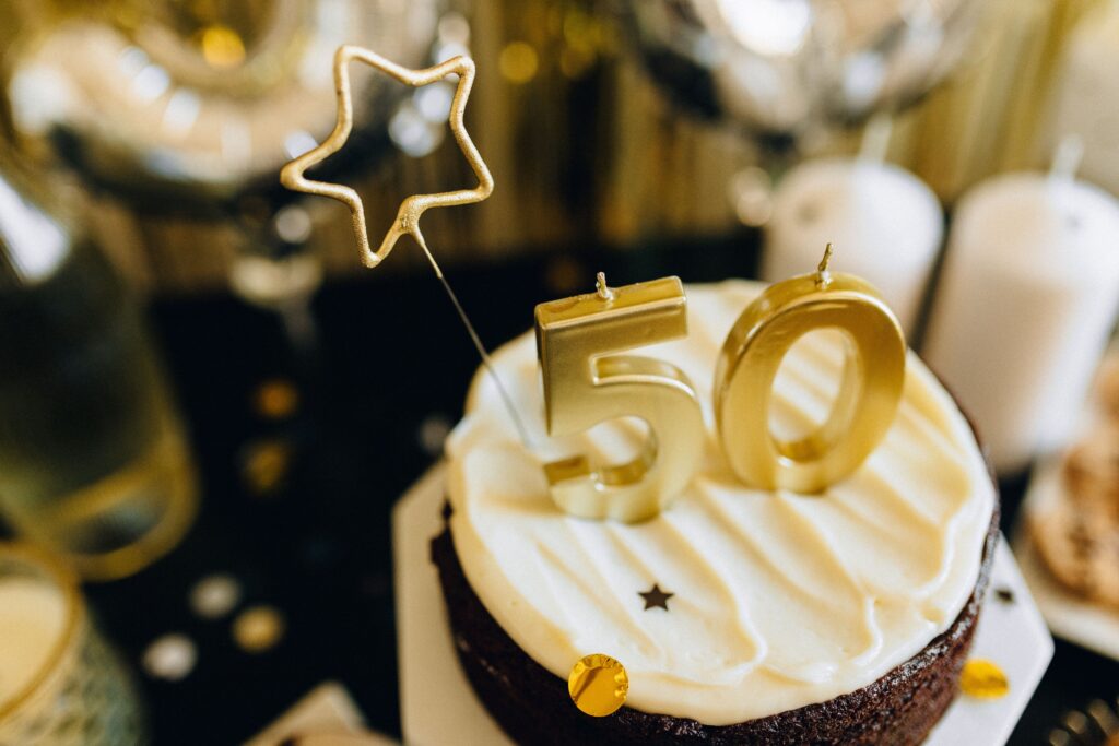 Elegant 50th birthday cake at a luxury milestone celebration